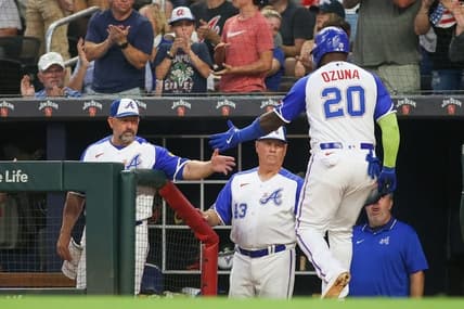 Jul 28, 2023; Atlanta, Georgia, USA; Atlanta Braves designated hitter Marcell Ozuna (20) celebrates with bench coach Walt Weiss (4) and manager Brian Snitker (43) after scoring against the Milwaukee Brewers in the second inning at Truist Park. Mandatory Credit: Brett Davis-USA TODAY Sports
