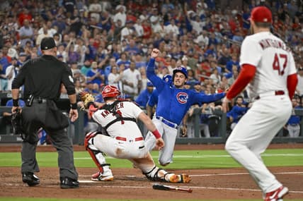 Jul 28, 2023; St. Louis, Missouri, USA;  Chicago Cubs center fielder Cody Bellinger (24) is tagged out at home plate by St. Louis Cardinals catcher Andrew Knizner (7) during the sixth inning at Busch Stadium. Mandatory Credit: Jeff Curry-USA TODAY Sports
