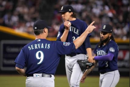Jul 28, 2023; Phoenix, Arizona, USA; Seattle Mariners manager Scott Servais (9) walks to the mound to remove Seattle Mariners starting pitcher Logan Gilbert (36) from the game against the Arizona Diamondbacks as Seattle Mariners shortstop J.P. Crawford (3) looks on during the seventh inning at Chase Field. Mandatory Credit: Joe Camporeale-USA TODAY Sports