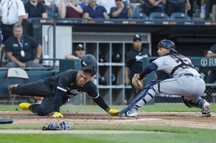 Jul 29, 2023; Chicago, Illinois, USA; Cleveland Guardians catcher Bo Naylor (23) tags out at home plate Chicago White Sox third baseman Yoan Moncada (10) during the fourth inning at Guaranteed Rate Field. Mandatory Credit: Kamil Krzaczynski-USA TODAY Sports