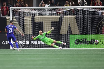 Jul 29, 2023; Atlanta, GA, USA; Cruz Azul forward Augusto Lotti (21) scores a goal during penalty shootout against Atlanta United goalkeeper Brad Guzan (1) at Mercedes-Benz Stadium. Mandatory Credit: Brett Davis-USA TODAY Sports