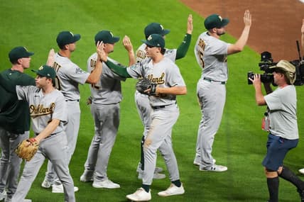 Jul 29, 2023; Denver, Colorado, USA; Oakland Athletics second baseman Zack Gelof (20) celebrates after defeating the Colorado Rockies at Coors Field. Mandatory Credit: Ron Chenoy-USA TODAY Sports