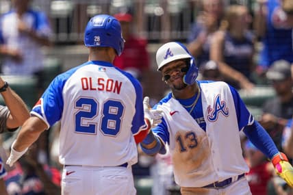 Jul 30, 2023; Cumberland, Georgia, USA; Atlanta Braves first baseman Matt Olson (28) reacts with right fielder Ronald Acuna Jr. (13) after hitting a three run home run against the Milwaukee Brewers during the third inning at Truist Park. Mandatory Credit: Dale Zanine-USA TODAY Sports