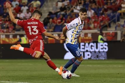 Jul 30, 2023; Harrison, NJ, USA; New York Red Bulls forward Dante Vanzeir (13) shoots the ball in front of Atletico De San Luis defender Pablo Martinez (28) during the second half at Red Bull Arena. Mandatory Credit: Vincent Carchietta-USA TODAY Sports