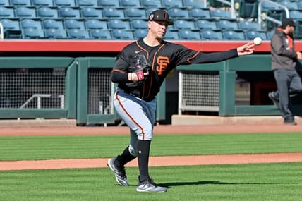 Feb 16, 2023; Scottsdale, AZ, USA; San Francisco Giants pitcher Kyle Harrison (86) throws to first base during a drill during a Spring Training workout at Scottsdale Stadium. Mandatory Credit: Matt Kartozian-USA TODAY Sports