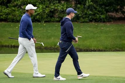 Apr 3, 2023; Augusta, Georgia, USA; Tiger Woods and Rory McIlroy walk onto the 11th green during a practice round for The Masters golf tournament at Augusta National Golf Club. Mandatory Credit: Michael Madrid-USA TODAY Network