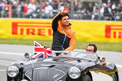 Jun 18, 2023; Montreal, Quebec, CAN; McLaren driver Lando Norris (GBR) parades and salutes the crowd before the Canadian Grand Prix at Circuit Gilles Villeneuve. Mandatory Credit: David Kirouac-USA TODAY Sports