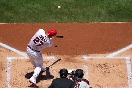 Jul 2, 2023; Anaheim, California, USA; Los Angeles Angels center fielder Mike Trout (27) hits a solo home run in the first inning against the Arizona Diamondbacks at Angel Stadium. Mandatory Credit: Kirby Lee-USA TODAY Sports