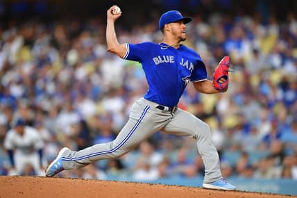 Jul 24, 2023; Los Angeles, California, USA; Toronto Blue Jays starting pitcher Jose Berrios (17) throws against the Los Angeles Dodgers during the first inning at Dodger Stadium. Mandatory Credit: Gary A. Vasquez-USA TODAY Sports