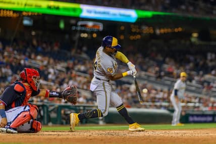 Jul 31, 2023; Washington, District of Columbia, USA; Milwaukee Brewers third baseman Andruw Monasterio (14) hits a single during the sixth inning against the Washington Nationals at Nationals Park. Mandatory Credit: Reggie Hildred-USA TODAY Sports