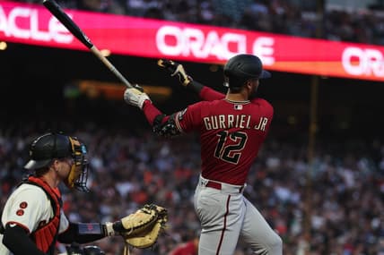 Jul 31, 2023; San Francisco, California, USA; Arizona Diamondbacks left fielder Lourdes Gurriel Jr. (12) hits an RBI single during the sixth inning against the San Francisco Giants at Oracle Park. Mandatory Credit: Sergio Estrada-USA TODAY Sports