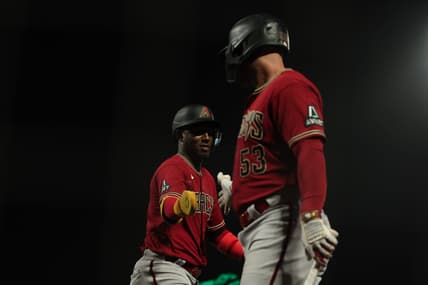 Jul 31, 2023; San Francisco, California, USA; Arizona Diamondbacks shortstop Geraldo Perdomo (2) is congratulated by first baseman Christian Walker (53) after scoring a run during the eleventh inning against the San Francisco Giants at Oracle Park. Mandatory Credit: Sergio Estrada-USA TODAY Sports