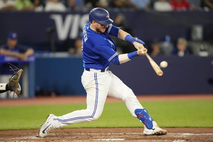 Aug 1, 2023; Toronto, Ontario, CAN; Toronto Blue Jays catcher Danny Jansen (9) hits a two run home run against the Baltimore Orioles during the second inning at Rogers Centre. Mandatory Credit: John E. Sokolowski-USA TODAY Sports