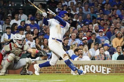 Aug 1, 2023; Chicago, Illinois, USA; Chicago Cubs right fielder Mike Tauchman (40) hits a three-run homer against the Cincinnati Reds during the third inning at Wrigley Field. Mandatory Credit: David Banks-USA TODAY Sports
