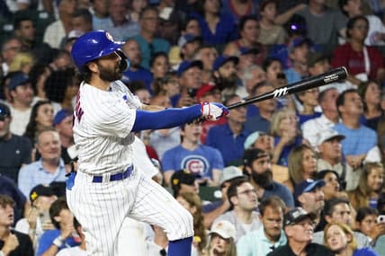Aug 1, 2023; Chicago, Illinois, USA; Chicago Cubs shortstop Dansby Swanson (7) hits a two-run homer against the Cincinnati Reds during the fourth inning at Wrigley Field. Mandatory Credit: David Banks-USA TODAY Sports