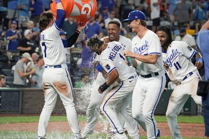 Aug 1, 2023; Kansas City, Missouri, USA; Kansas City Royals right fielder MJ Melendez (1) is doused by shortstop Bobby Witt Jr. (7) after scoring the game winning run against the New York Mets on a walk off balk in the tenth inning at Kauffman Stadium. Mandatory Credit: Denny Medley-USA TODAY Sports