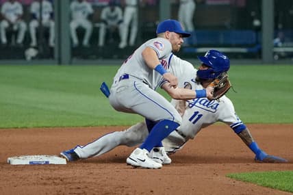 Aug 1, 2023; Kansas City, Missouri, USA; New York Mets second baseman Danny Mendick (15) attempts to make the tag as Kansas City Royals third baseman Maikel Garcia (11) steals second base in the seventh inning at Kauffman Stadium. Mandatory Credit: Denny Medley-USA TODAY Sports