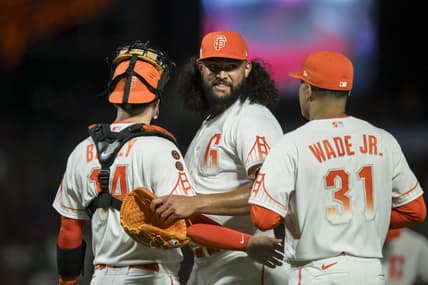 Aug 1, 2023; San Francisco, California, USA;  San Francisco Giants relief pitcher Sean Manaea (52) celebrates with catcher Patrick Bailey (14) and first baseman LaMonte Wade Jr. (31) after a win against the Arizona Diamondbacks at Oracle Park. Mandatory Credit: John Hefti-USA TODAY Sports