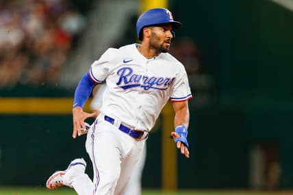Aug 2, 2023; Arlington, Texas, USA; Texas Rangers second baseman Marcus Semien (2) heads to third base during the second inning against the Chicago White Sox at Globe Life Field. Mandatory Credit: Andrew Dieb-USA TODAY Sports
