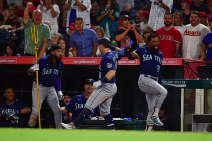 August 3, 2023; Anaheim, California, USA; Seattle Mariners left fielder Cade Marlowe (18) is greeted by shortstop J.P. Crawford (3) and designated hitter Teoscar Hernandez (35) after hitting a grand slam home run against the Los Angeles Angels during the ninth inning at Angel Stadium. Mandatory Credit: Gary A. Vasquez-USA TODAY Sports
