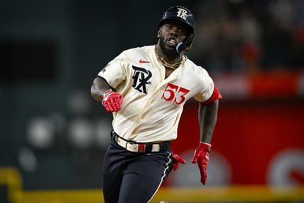 Aug 4, 2023; Arlington, Texas, USA; Texas Rangers right fielder Adolis Garcia (53) runs to third base during the seventh inning against the Miami Marlins at Globe Life Field. Mandatory Credit: Jerome Miron-USA TODAY Sports