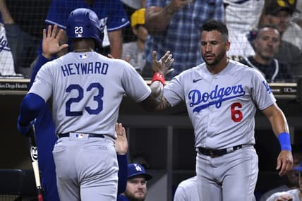 Aug 4, 2023; San Diego, California, USA; Los Angeles Dodgers right fielder Jason Heyward (23) is congratulated by designated hitter David Peralta (6) after scoring a run against the San Diego Padres during the eighth inning at Petco Park. Mandatory Credit: Orlando Ramirez-USA TODAY Sports