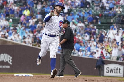 Aug 5, 2023; Chicago, Illinois, USA; Chicago Cubs shortstop Dansby Swanson (7) gestures after hitting a two-run home run against the Atlanta Braves during the first inning at Wrigley Field. Mandatory Credit: David Banks-USA TODAY Sports
