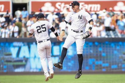 Aug 5, 2023; Bronx, New York, USA;  New York Yankees second baseman Gleyber Torres (25) and right fielder Aaron Judge (99) celebrate after defeating the Houston Astros 3-1 at Yankee Stadium. Mandatory Credit: Wendell Cruz-USA TODAY Sports