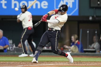 Aug 5, 2023; Arlington, Texas, USA; Texas Rangers designated hitter Robbie Grossman (4) hits an three-run home run against the Miami Marlins during the fourth inning at Globe Life Field. Mandatory Credit: Jim Cowsert-USA TODAY Sports