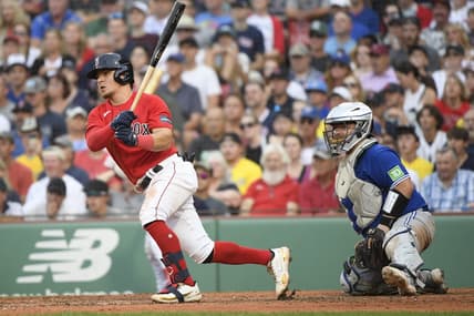 Aug 5, 2023; Boston, Massachusetts, USA;  Boston Red Sox third baseman Luis Urias (17) hits an RBI single during the ninth inning against the Toronto Blue Jays at Fenway Park. Mandatory Credit: Bob DeChiara-USA TODAY Sports