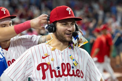 Aug 5, 2023; Philadelphia, Pennsylvania, USA; Philadelphia Phillies shortstop Trea Turner (7) has food and gum and water dumped on him during an interview after a victory against the Kansas City Royals at Citizens Bank Park. Mandatory Credit: Bill Streicher-USA TODAY Sports