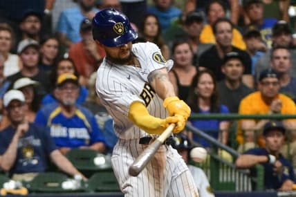 Aug 5, 2023; Milwaukee, Wisconsin, USA;  Milwaukee Brewers right fielder Blake Perkins (16) drives in the winning run with a base hit in the tenth inning against the Pittsburgh Pirates at American Family Field. Mandatory Credit: Benny Sieu-USA TODAY Sports