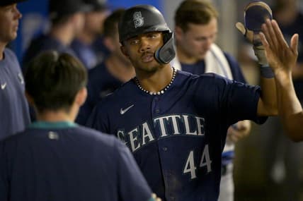 Aug 5, 2023; Anaheim, California, USA;  Seattle Mariners center fielder Julio Rodriguez (44) is congratulated in the dugout after scoring a run in the eighth inning against the Los Angeles Angels at Angel Stadium. Mandatory Credit: Jayne Kamin-Oncea-USA TODAY Sports