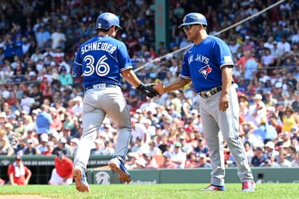 Aug 6, 2023; Boston, Massachusetts, USA; Toronto Blue Jays second baseman Davis Schneider (36) celebrates a two run home run against the Boston Red Sox with third base coach Luis Rivera (20) in the fourth inning at Fenway Park. Mandatory Credit: Eric Canha-USA TODAY Sports