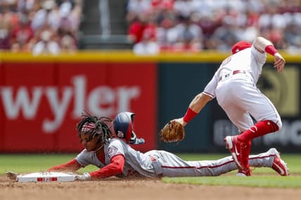 Aug 6, 2023; Cincinnati, Ohio, USA; Cincinnati Reds second baseman Matt McLain (9) attempts to tag out Washington Nationals shortstop CJ Abrams (5) at second in the second inning at Great American Ball Park. Mandatory Credit: Katie Stratman-USA TODAY Sports