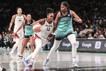 Aug 6, 2023; Brooklyn, New York, USA;  Las Vegas Aces guard Chelsea Gray (12) looks to drive past New York Liberty forward Jonquel Jones (35) in the third quarter at Barclays Center. Mandatory Credit: Wendell Cruz-USA TODAY Sports