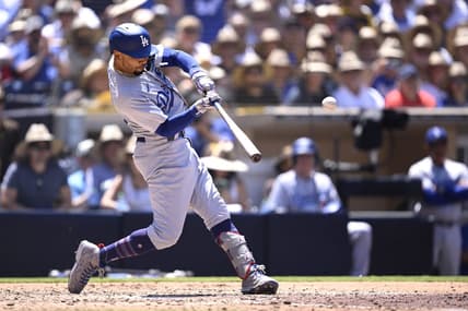 Aug 7, 2023; San Diego, California, USA; Los Angeles Dodgers second baseman Mookie Betts (50) hits a grand slam home run during the fourth inning against the San Diego Padres at Petco Park. Mandatory Credit: Orlando Ramirez-USA TODAY Sports