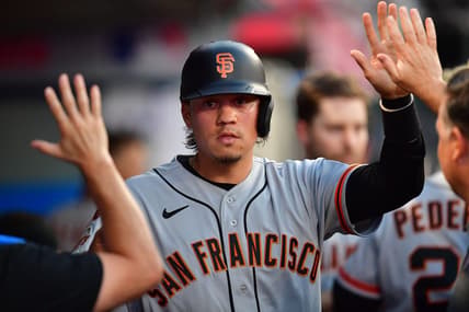 Aug 7, 2023; Anaheim, California, USA; San Francisco Giants first baseman Wilmer Flores (41) is greeted after scoring a run against the Los Angeles Angels during the fourth inning at Angel Stadium. Mandatory Credit: Gary A. Vasquez-USA TODAY Sports