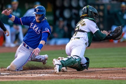 Aug 8, 2023; Oakland, California, USA;  Texas Rangers catcher Sam Huff (55) scores on a single hit by Texas Rangers second baseman Marcus Semien (not pictured) against the Oakland Athletics during the fourth inning at Oakland-Alameda County Coliseum. Mandatory Credit: Neville E. Guard-USA TODAY Sports