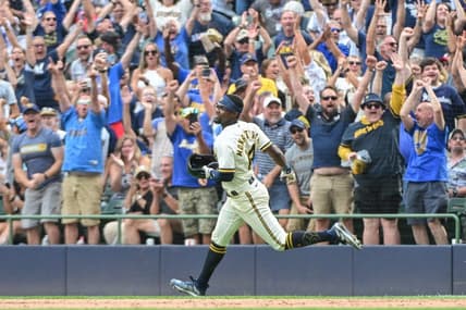 Aug 9, 2023; Milwaukee, Wisconsin, USA; Milwaukee Brewers third baseman Andruw Monasterio (14) and fans celebrate after beating the Colorado Rockies at American Family Field. Mandatory Credit: Benny Sieu-USA TODAY Sports