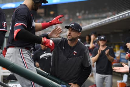 Aug 9, 2023; Detroit, Michigan, USA;  Minnesota Twins first baseman Joey Gallo (13) is congratulated on the dug out steps by manager Rocco Baldelli (5) after hitting a two run home run off Detroit Tigers starting pitcher Alex Faedo (49) (not pictured)  in the second inning at Comerica Park. Mandatory Credit: Lon Horwedel-USA TODAY Sports
