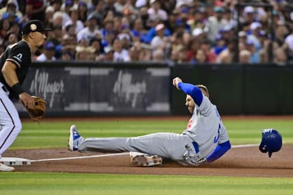 Aug 9, 2023; Phoenix, Arizona, USA;  Los Angeles Dodgers first baseman Freddie Freeman (5) slides into third base in the fourth inning at Chase Field. Mandatory Credit: Matt Kartozian-USA TODAY Sports