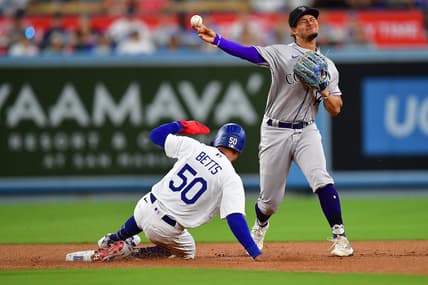 Aug 10, 2023; Los Angeles, California, USA; Los Angeles Dodgers right fielder Mookie Betts (50) is out at second as Colorado Rockies shortstop Ezequiel Tovar (14) is late on the throw to first during the third inning at Dodger Stadium. Mandatory Credit: Gary A. Vasquez-USA TODAY Sports