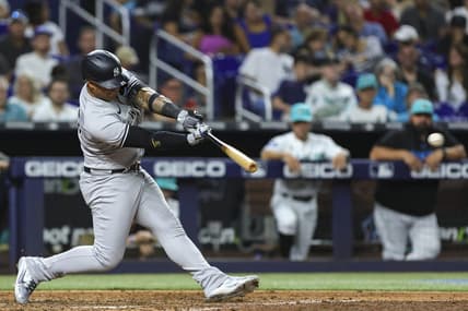 Aug 11, 2023; Miami, Florida, USA; New York Yankees second baseman Gleyber Torres (25) hits a double against the Miami Marlins during the sixth inning at loanDepot Park. Mandatory Credit: Sam Navarro-USA TODAY Sports