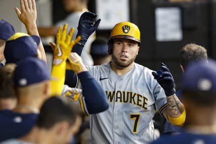 Aug 11, 2023; Chicago, Illinois, USA; Milwaukee Brewers catcher Victor Caratini (7) celebrates with teammates after scoring against the Chicago White Sox during the second inning at Guaranteed Rate Field. Mandatory Credit: Kamil Krzaczynski-USA TODAY Sports