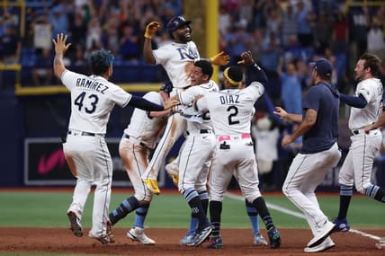 Aug 12, 2023; St. Petersburg, Florida, USA;  Tampa Bay Rays left fielder Randy Arozarena (56) is congratulated after he hit a walk off RBI single against the Cleveland Guardians during the ninth inning at Tropicana Field. Mandatory Credit: Kim Klement Neitzel-USA TODAY Sports
