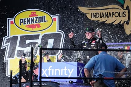 NASCAR Xfinity Series driver Ty Gibbs (19) celebrates on the victory podium Saturday, Aug. 12, 2023, following the NASCAR Xfinity Series Pennzoil 150 at Indianapolis Motor Speedway.