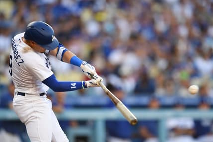 Aug 12, 2023; Los Angeles, California, USA; Los Angeles Dodgers shortstop Enrique Hernandez (8) doubles against the Colorado Rockies during the second inning at Dodger Stadium. Mandatory Credit: Jonathan Hui-USA TODAY Sports