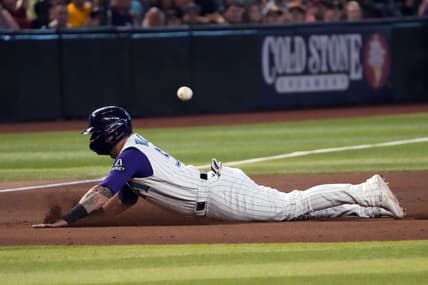 Aug 13, 2023; Phoenix, Arizona, USA; Arizona Diamondbacks first baseman Christian Walker (53) slides into third base against the San Diego Padres during the eighth inning at Chase Field. Mandatory Credit: Joe Camporeale-USA TODAY Sports