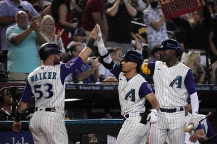 Aug 13, 2023; Phoenix, Arizona, USA; Arizona Diamondbacks first baseman Christian Walker (53) and Arizona Diamondbacks center fielder Alek Thomas (5) an Arizona Diamondbacks shortstop Geraldo Perdomo (2) celebrate during the eighth inning against the San Diego Padres at Chase Field. Mandatory Credit: Joe Camporeale-USA TODAY Sports